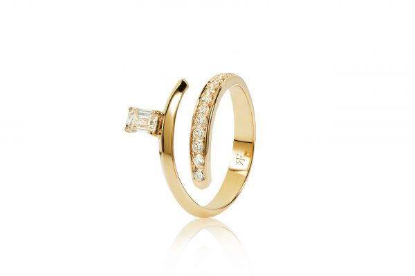 18ct gold White Diamond twist ring with central Emerald Cut Diamond.