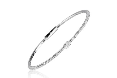 18ct gold White Diamond flexible core bangle with one central Oval Diamond