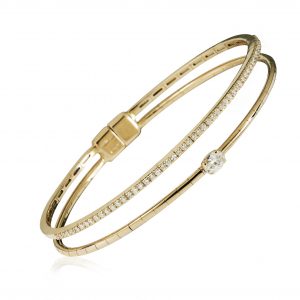18ct gold White Diamond flexible core bangle with one central Oval Diamond