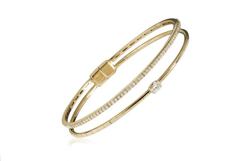 18ct gold White Diamond flexible core bangle with one central Oval Diamond