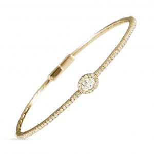 18ct gold White Diamond flexible core bangle with one central Oval Diamond