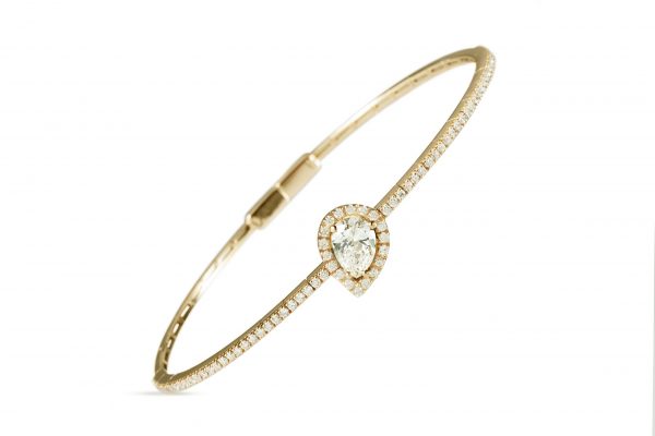 18ct gold White Diamond flexible core bangle with one central Pear Shaped Diamond