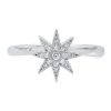 An 18ct gold ring, set with 0.12ct white diamonds. Star measures 7mm