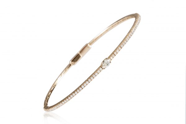 18ct gold White Diamond flexible core bangle with one central Pear-Shaped Diamond
