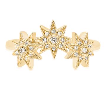 An 18ct gold ring, set with 0.12ct white diamonds. Stars measure 7 mm each Total of all three stars 21mm in yellow gold.