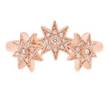 An 18ct gold ring, set with 0.12ct white diamonds. Stars measure 7 mm each Total of all three stars 21mm in rose gold