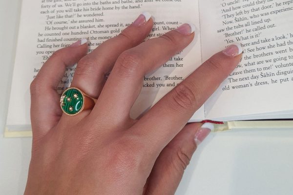 Moon and Stars Signet Ring An 18 carat rose gold ring, set with 0.043 carats of white diamonds Hardstone malachite